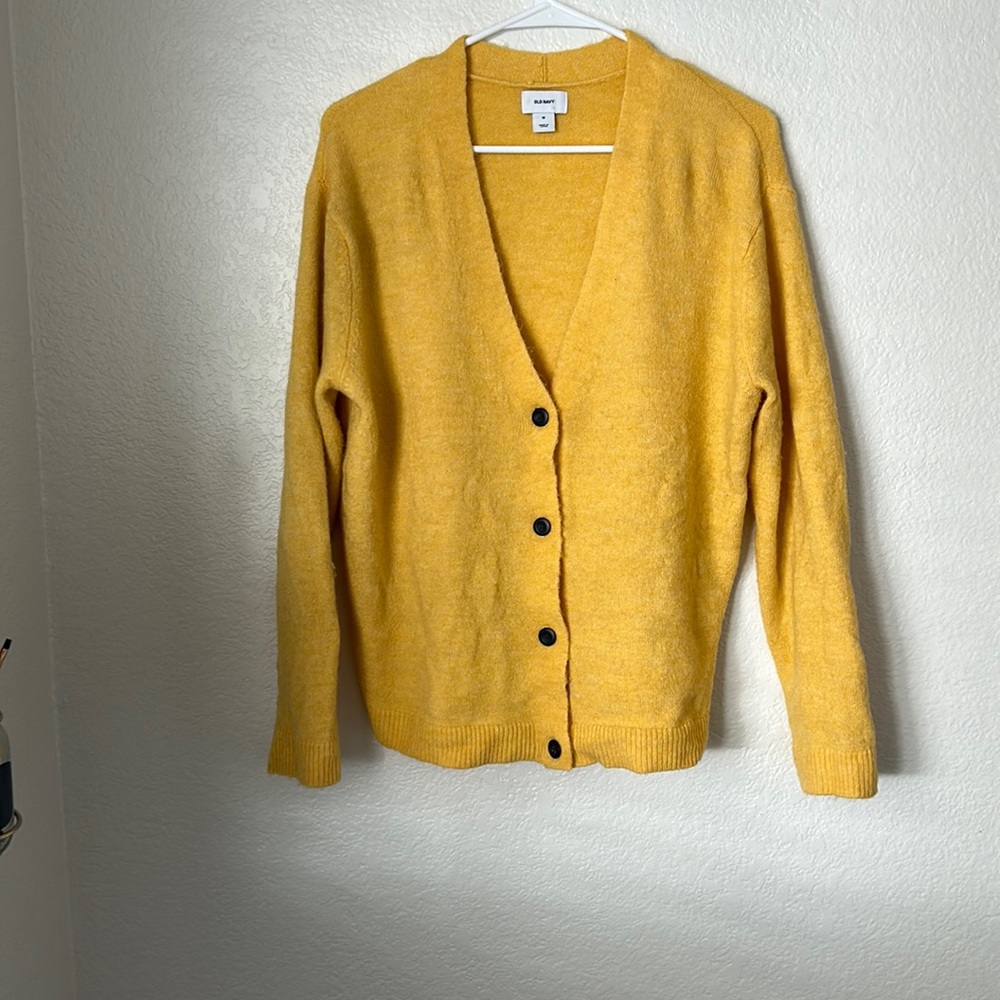 Canary, yellow sweater/cardigan
